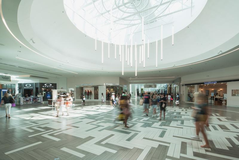 Interior concourse with patterned flooring and light installation — The Florida Mall, Orlando FL