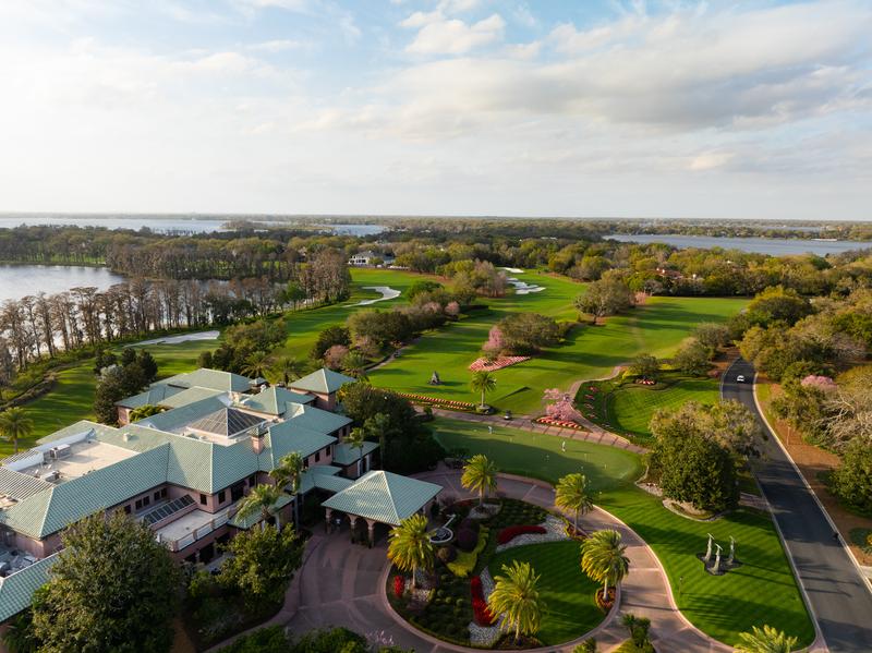 Aerial view of the clubhouse, practice green, and entry drive — Isleworth Golf and Country Club, Windermere FL