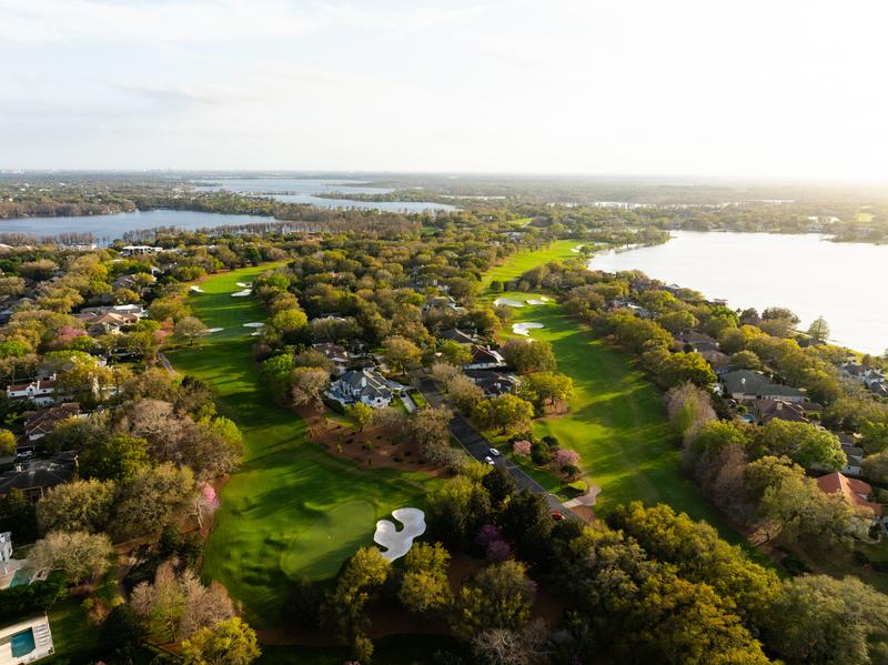Course and the Butler Chain of Lakes toward the sun — Isleworth Golf and Country Club, Windermere FL