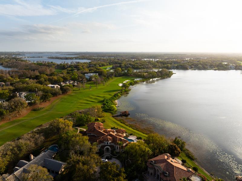 Lakefront fairway at golden hour — Isleworth Golf and Country Club, Windermere FL
