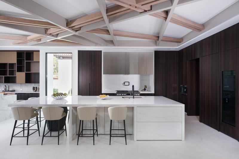 Kitchen with island seating and beamed ceiling — The New American Home 2026, Orlando FL