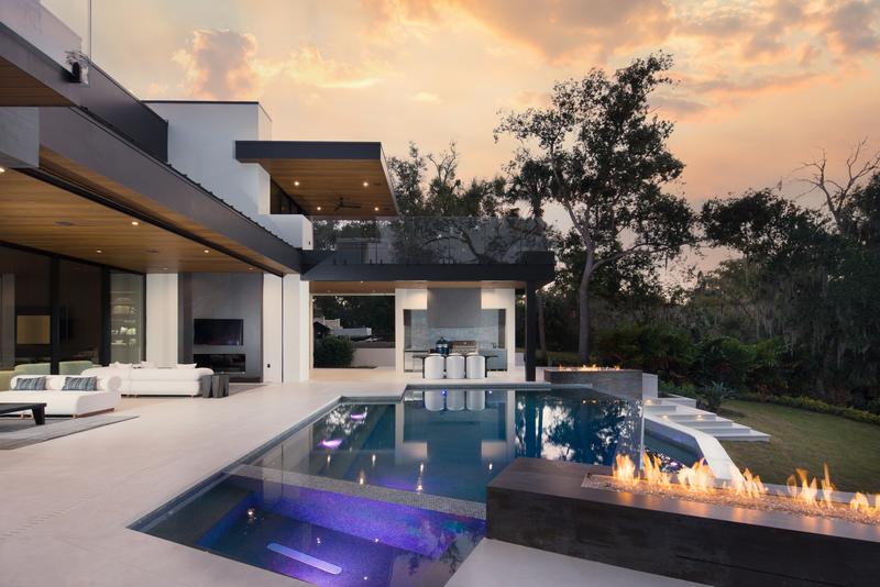 Pool with fire bowls at sunset — The New American Home 2026, Orlando FL