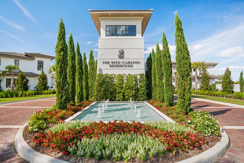 Community entry monument with fountain and formal landscaping — Ritz-Carlton Residences at Grande Lakes, Orlando FL