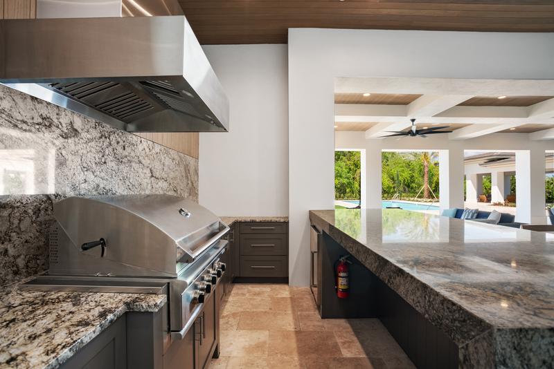 Outdoor summer kitchen with granite counters — Ritz-Carlton Residences at Grande Lakes, Orlando FL