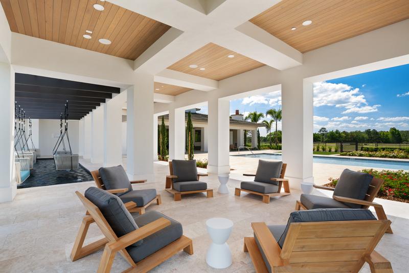 Poolside lounge chairs beneath the pavilion — Ritz-Carlton Residences at Grande Lakes, Orlando FL