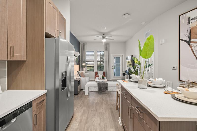 Model unit kitchen with stainless appliances — Sanctuary at Daytona apartments, Daytona Beach FL