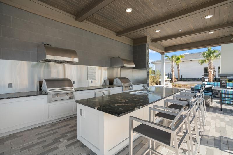 Outdoor grilling stations by the pool — Sanctuary at Daytona apartments, Daytona Beach FL